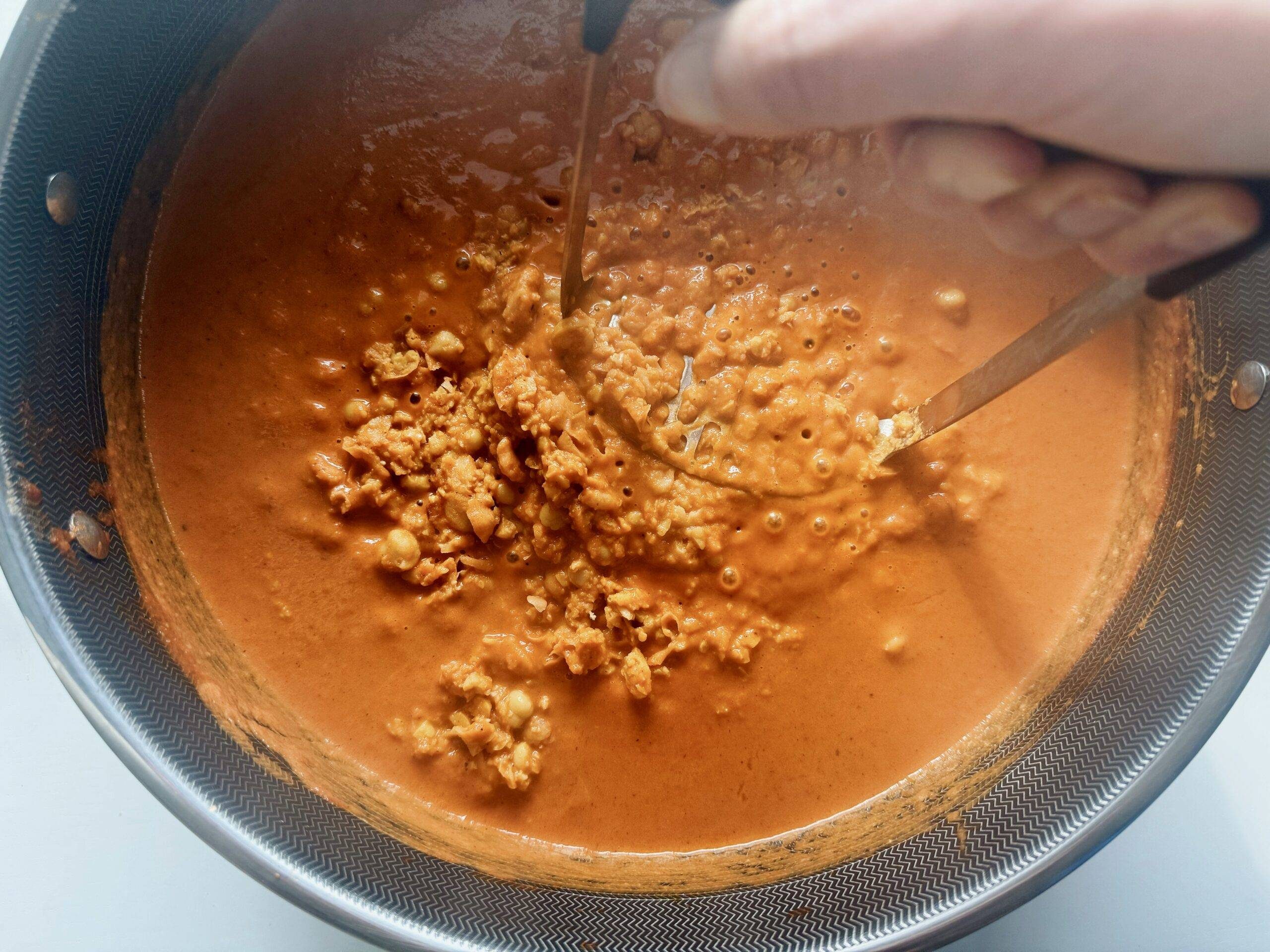 Add chickpeas and mash.