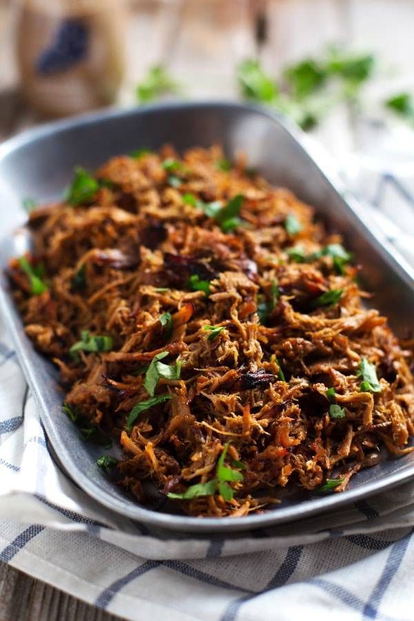 Pork on a metal tray.