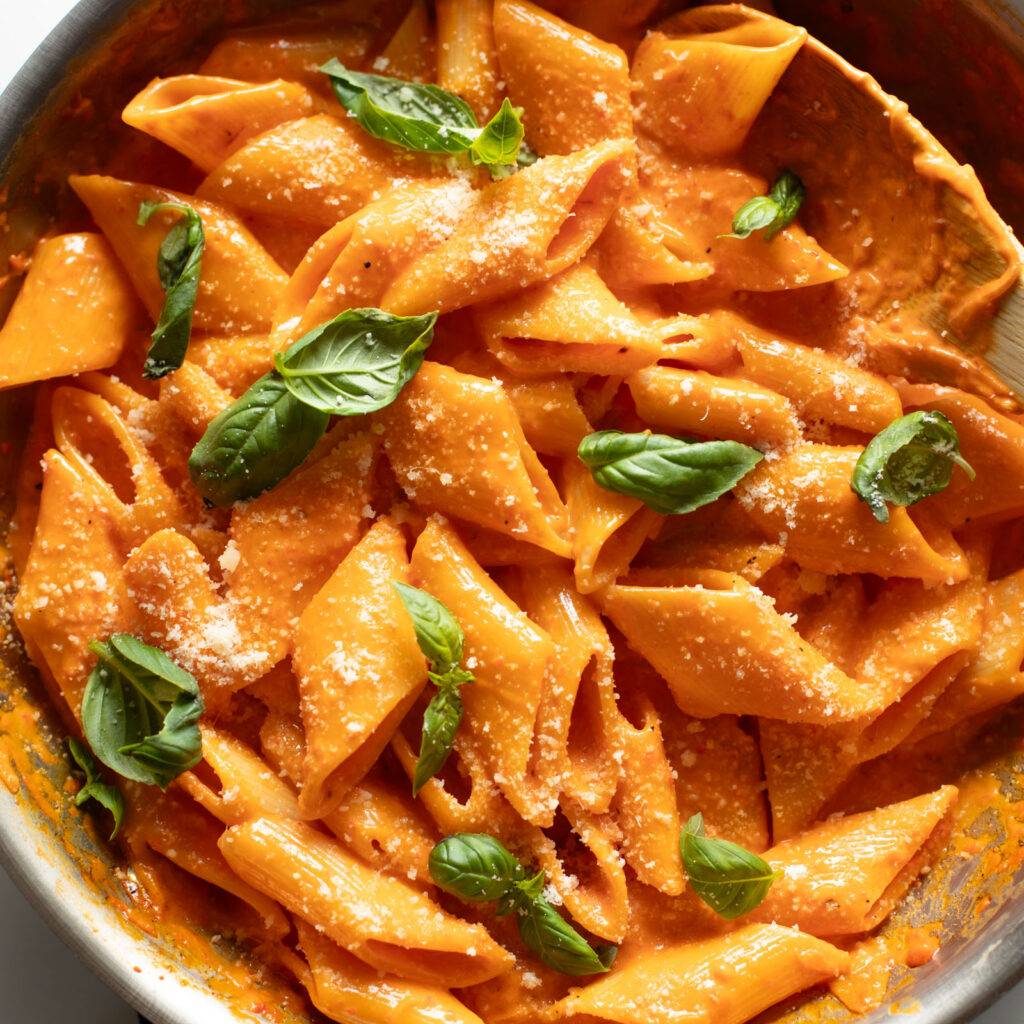 Roasted red pepper pasta in a skillet.