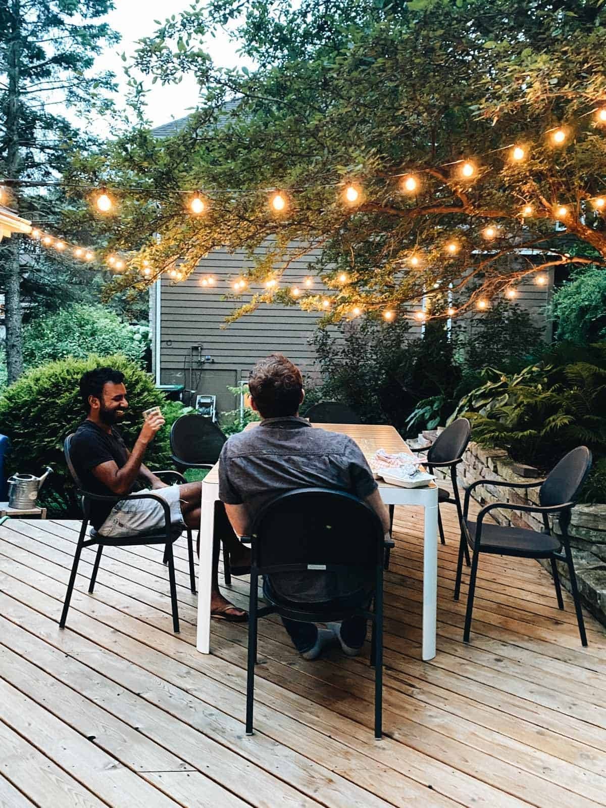People sitting outside at an outdoor patio.
