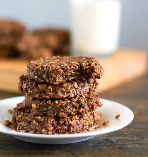 Snickers cookies stacked on each other on a plate.