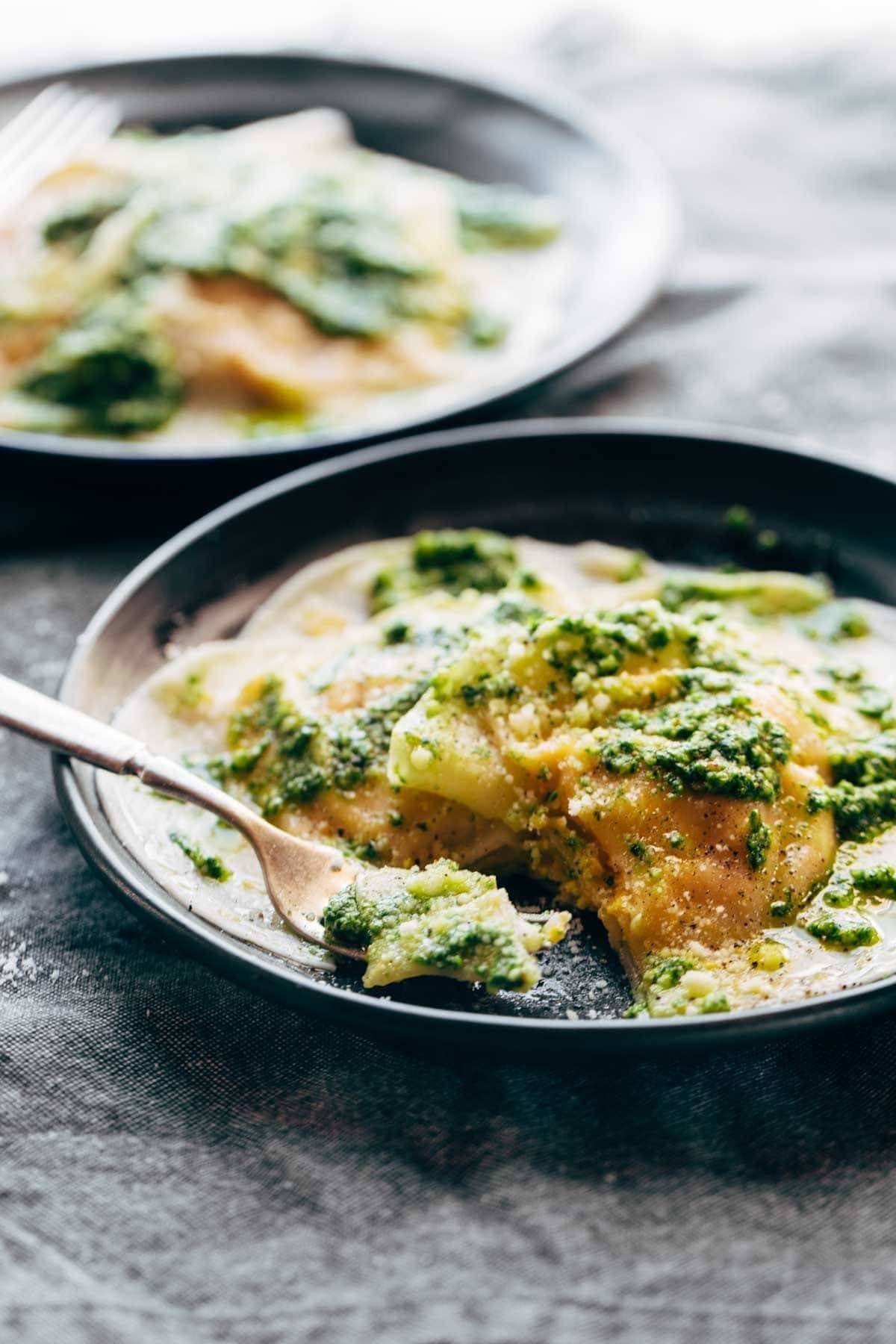 Butternut Squash Ravioli on a plate with a fork.